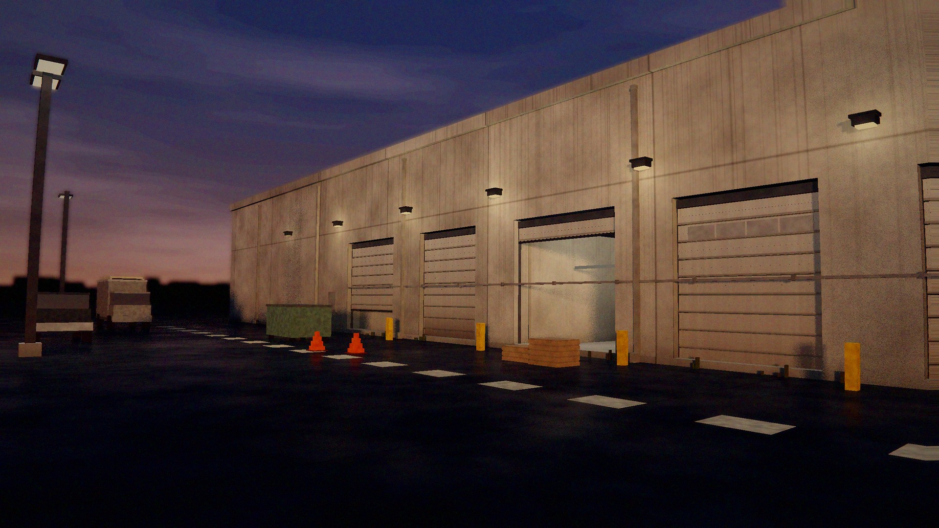 Commercial overhead doors on an industrial building at dusk